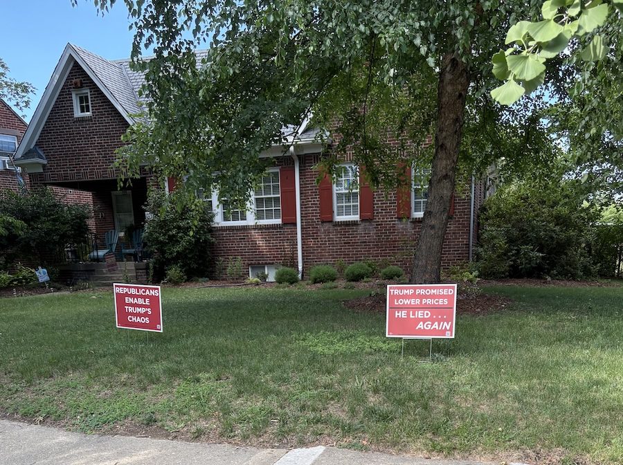Republicans Enable Trump's Chaos and Trump Promised Lower Prices signs in a front yard
